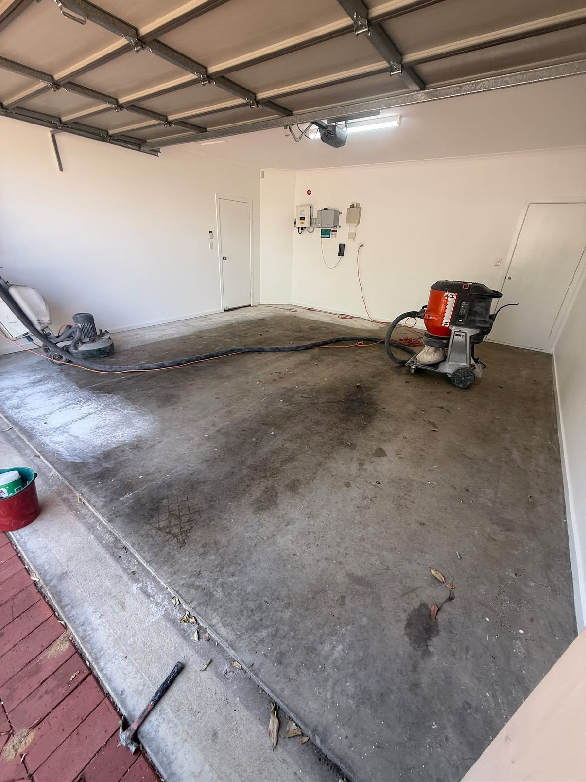 Standard double garage floor — bare concrete before