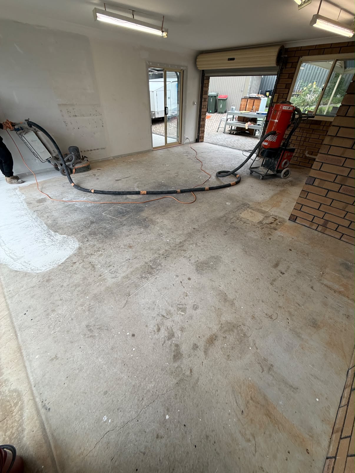 Standard double garage floor — bare concrete before